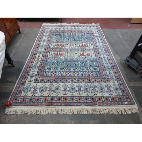 673 - Star Lot : A lovely large hand made and hand knotted low pile 100% wool floor rug with geometric des... 