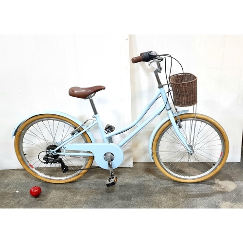 676 - A Martello Button girl's bicycle with wicker basket to front, Shimano gears and finished in a baby b... 