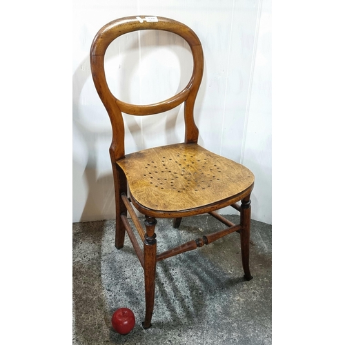 677 - A beautiful unusual  antique chair with open balloon back and pierced seat.