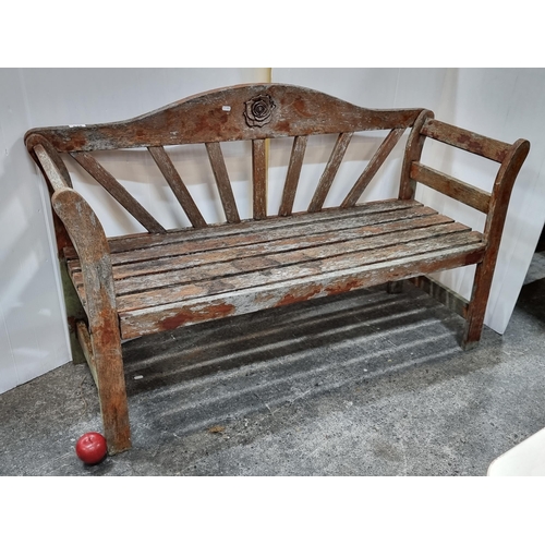 679 - A solid wood garden bench with lovely rose motif to back. Would look amazing stained or painted has ... 