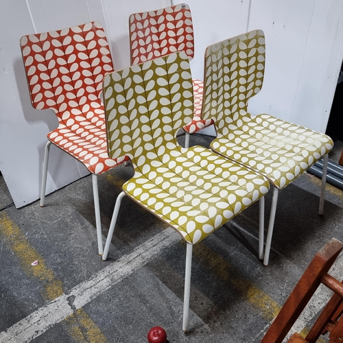 686 - Star Lot : A set of four Orla Kiely stem design stacking chairs in orange and green.