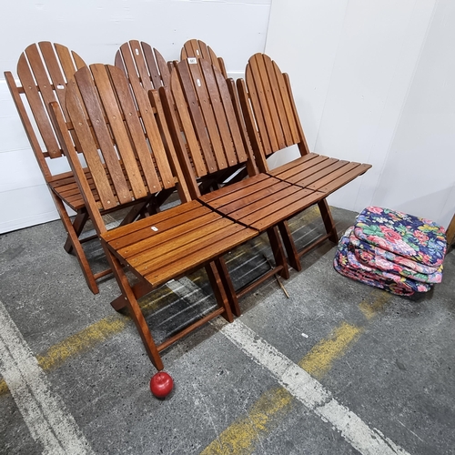 687 - Six foldable wooden outdoor chairs with floral cushions. These are super nice look almost new. Handy... 