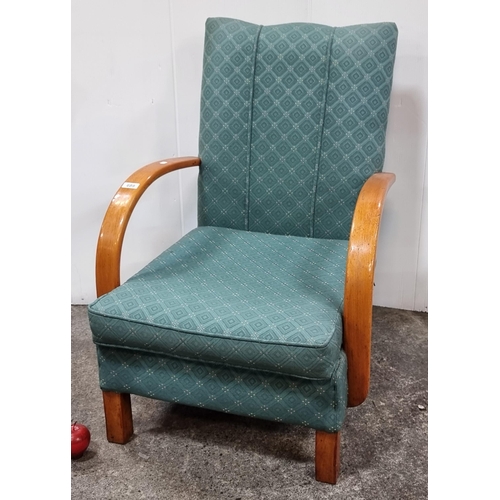 689 - A very comfortable deep seated open armed chair with bent wood arms and upholstered in a green fabri... 