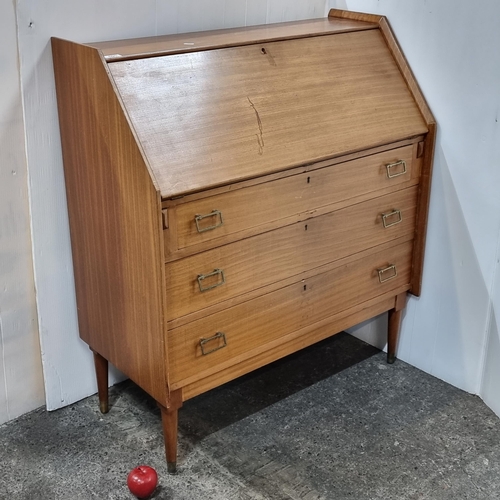 690 - Star Lot : A stunning mid century modern teak writing bureau  featuring three drawers with pull hand... 