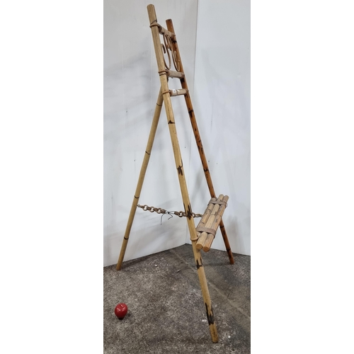 693 - Star Lot :A highly unusual full size antique easel. Hand constructed from bamboo with cane binding. ... 