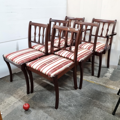 697 - Six dining chairs, two with open arms. Open slat back and upholstered in a red, white and gold fabri... 