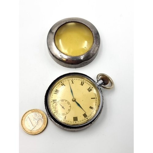 839 - a nice open face top wind pocket watch Swiss made with a heavy outer protective case. Watch winds an... 