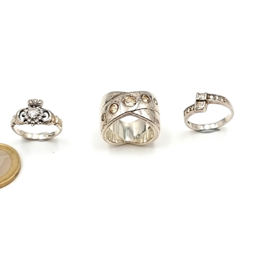 853 - Three Sterling Silver rings Inc a large heavy example and a vintage gemset Claddagh ring.