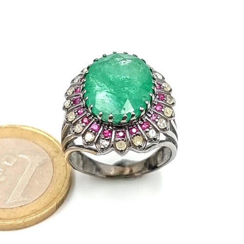 856 - Star lot : A fabulous Emerald and Diamond ring. The Emerald is 10.4cts and there is 0.4cts of Diamon... 