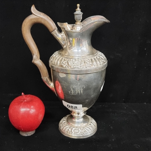 88 - An antique silver plated wine jug by James Dixon & Sons. A very elegant piece with decoration in hig... 