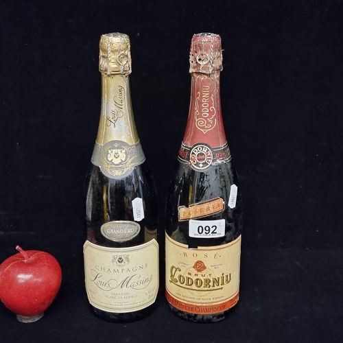 92 - Two sealed 75cl bottles, including a bottle of Louis Massing Grand Cru Champagne, and a Codorníu Ros... 