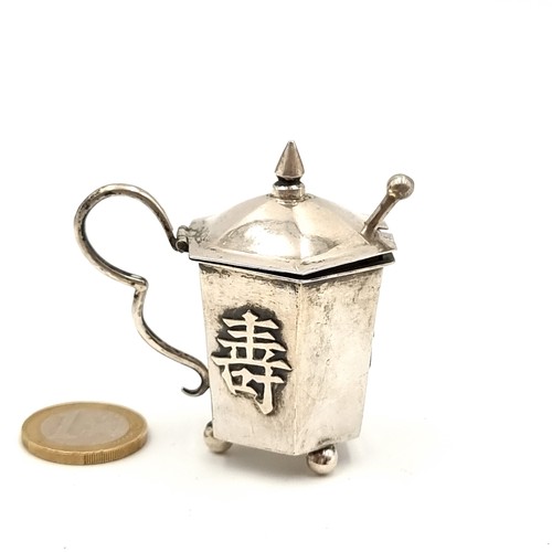 44 - A highly unusual silver Japanese Cruet, with original spoon and three balled feet. With insignia whi... 