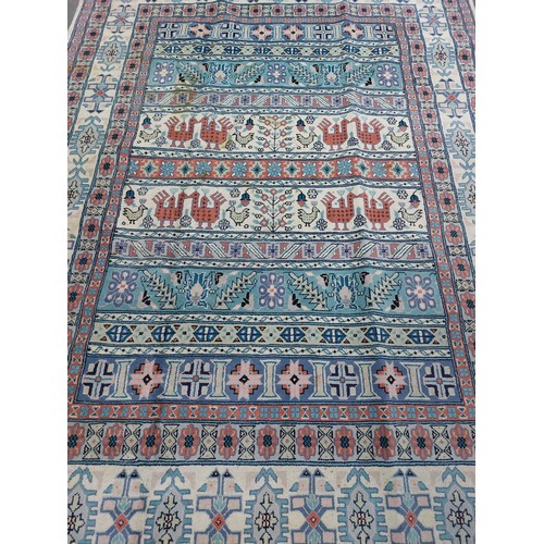 673 - Star Lot : A lovely large hand made and hand knotted low pile 100% wool floor rug with geometric des... 