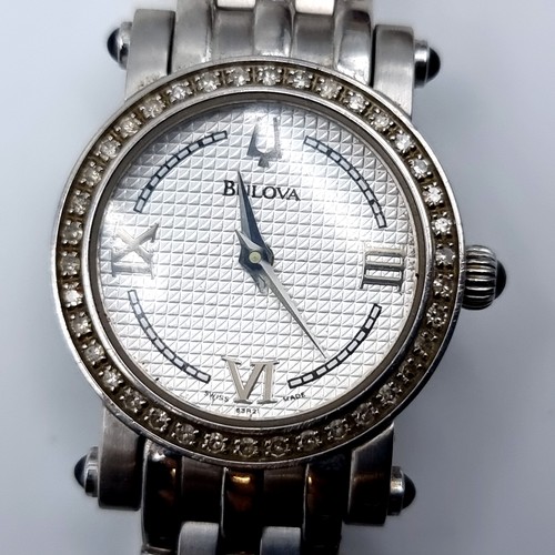 33 - Star Lot : An excellent example vintage ladies Bulova Diamond wrist watch, with Halo diamond set bez... 