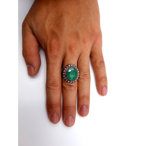 856 - Star lot : A fabulous Emerald and Diamond ring. The Emerald is 10.4cts and there is 0.4cts of Diamon... 