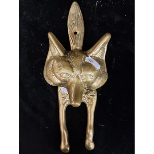 159 - A striking example of an antique brass figural doorknocker in the form of a fox. An unusually stylis... 