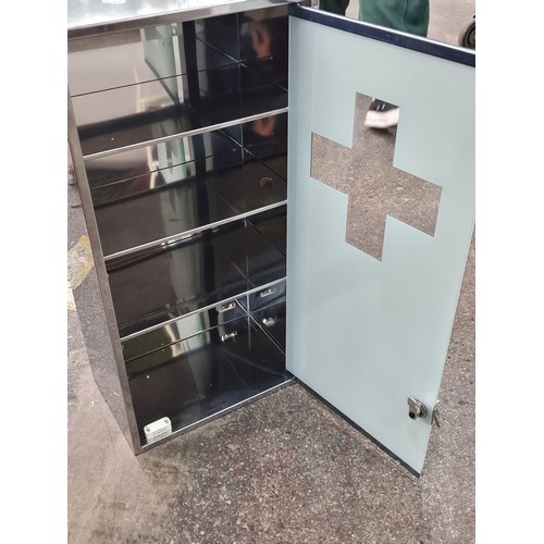 577 - A good sized wall mounting medicine cabinet with frosted glass door and three internal shelves. With... 