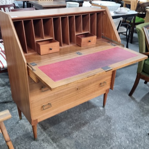 690 - Star Lot : A stunning mid century modern teak writing bureau  featuring three drawers with pull hand... 