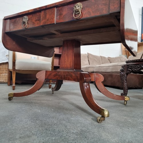 663 - Star Lot : An amazing large George IV tiger flame mahogany sofa table with drop leaf, quadroped pill... 