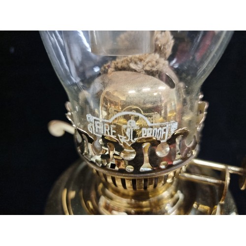 189 - A beautifully polished brass oil lamp with bevelled base and high quality duplex fittings in working... 