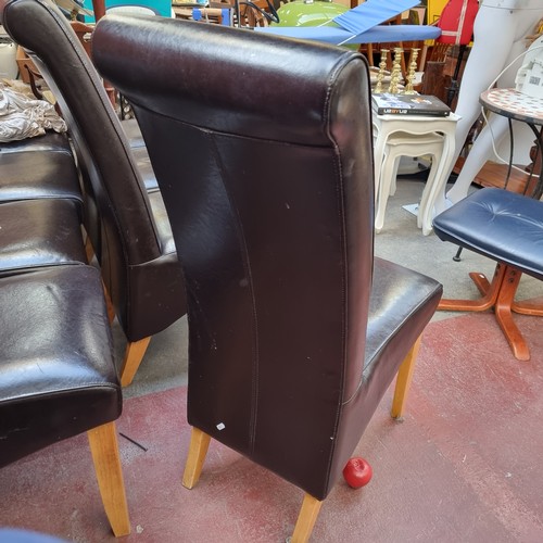 361 - 8 high back dining chairs with brown leather upholstery and tapered legs. Comes with stylish floral ... 