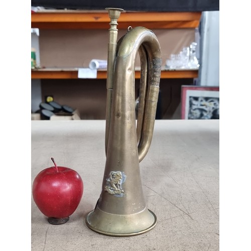 615 - A World War I British Indian Army brass bugle featuring the lion rampant badge of the Kumaon Regimen... 