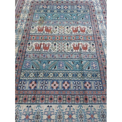 767 - Star Lot : A lovely large hand made and hand knotted low pile 100% wool floor rug with geometric des... 