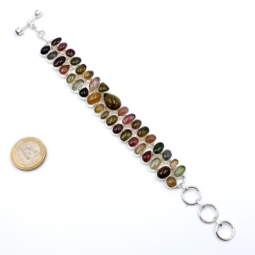 10 - A lovely example of a Cabochon natural coloured Tourmaline tennis bracelet, set in sterling silver a... 