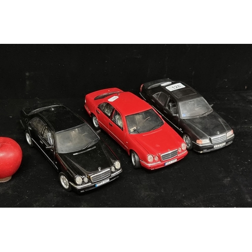 128 - A collection of three model cars including a Chevrolet Suburban (1/18) No. 9854 by Welly brand (RRP ... 