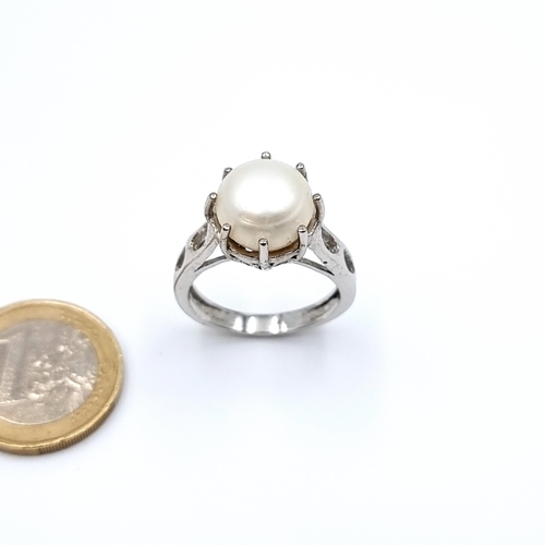 13 - A lovely lustre Fresh water Pearl ring, set with a claw setting pearl size  9 carats and set in ster... 
