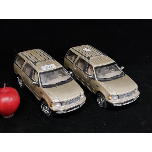 131 - A pair of collectable model Ford Expedition Jeeps by UT (1/18). RRP for €139.95 each on www.carmodel... 