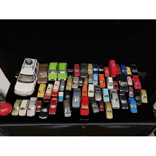 134 - A large box containing approximately forty model cars. Including examples by UT models, Corgi, Curso... 