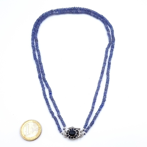14 - A very pretty 145 carat two strand graduated Tanzanite necklace, set with a sterling silver Blue Sap... 