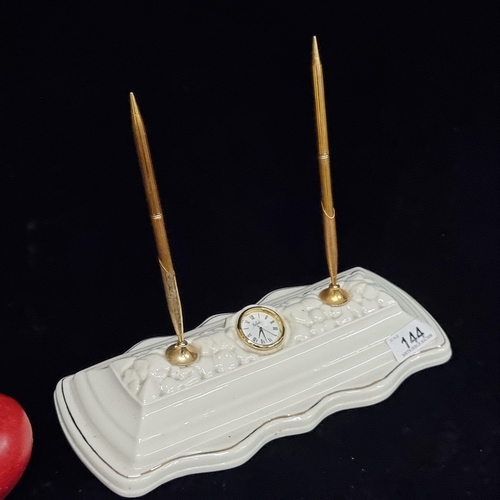 144 - An unusual Irish porcelain desk tidy by Belleek, including a pair of original brass pens and a neat ... 