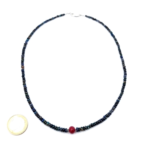 15 - An unusual single strand graduated 42 carat Blue Opal necklace, featuring a Ruby stone accent and a ... 