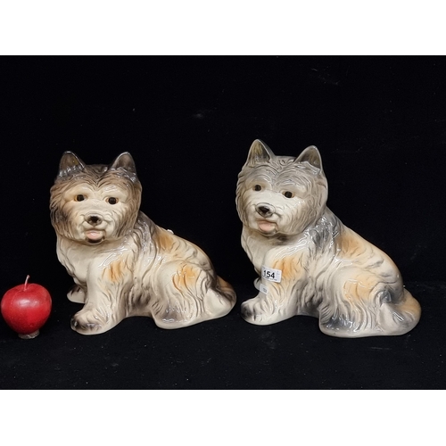 154 - A pair of vintage Yorkshire terrier ceramic figures, with cream and brown coat. Would make great gua... 