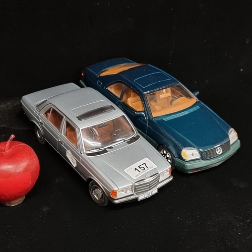 157 - Two collectible Mercedes model cars, including a Mercedes W 123 (1/18) by Revell 2005. And another S... 