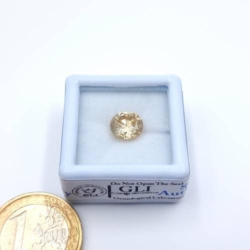 16 - A rare brilliant round cut gold Moissanite stone, of 2.01 carats.  These stones have many of the sam... 