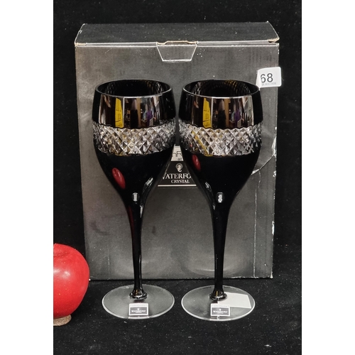 168 - A pair of unusual, stemmed wine glasses in black with diamond quilt banding designed by John Rocha f... 