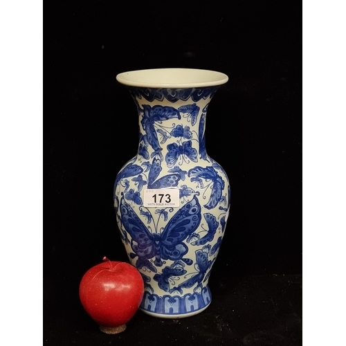 173 - An elegant, vintage celadon vase with ornate butterfly pattern in blue glaze featuring an apocryphal... 