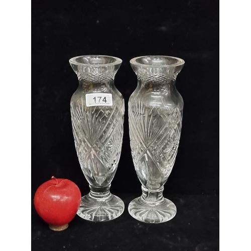 174 - A stylish pair of heavy cut crystal garniture vases, with diagonal fan cuts and slender form. H25cm.... 