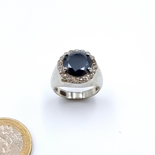 19 - A lovely black Moissanite and Diamond ring, set with a striking centre Black Moissanite stone of 5 c... 