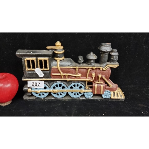 207 - A heavy, cast metal steam engine door stop, hand-painted in shades of blue, red and gold.