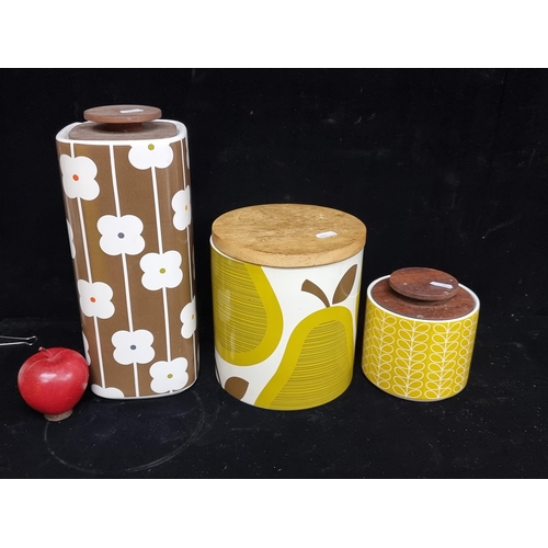 208 - Three collectible Orla Kiely stoneware jars with the iconic 1960s inspired designs and wooden lids.