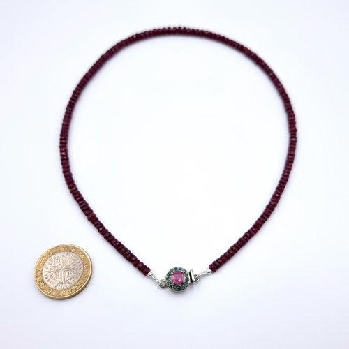21 - A fine example of a single strand graduated untreated Ruby necklace, of 110 carats and featuring a n... 