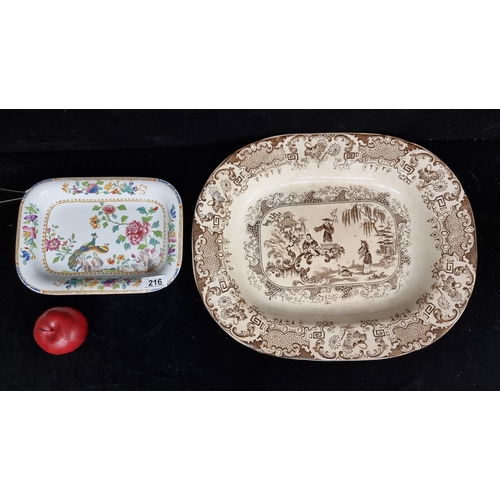 216 - Two Victorian serving plates of a Chinoiserie theme. Including a very large brown glaze Meat platter... 