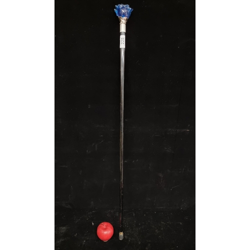 228 - An elegant and unusual walking stick, with silver plated collar and pommel in the form of a blue gla... 