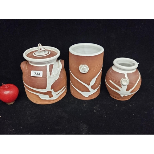 234 - A set of three pottery items by Stephen Pearse including a wine cooler and two jars, all with a terr... 