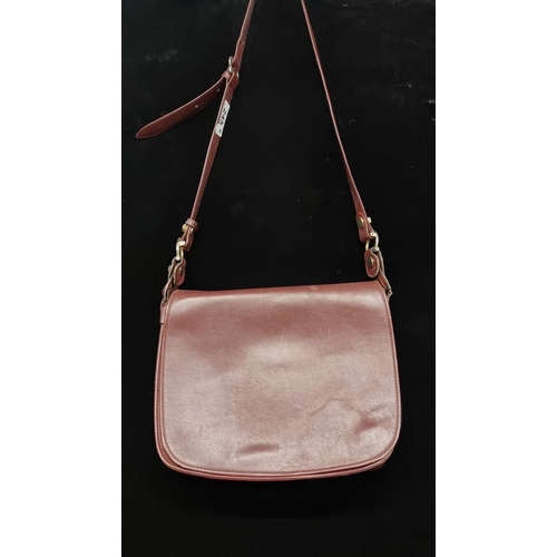 245 - A fabulous genuine leather satchel crossbody bag from Les Must de Cartier. In a maroon finish with p... 