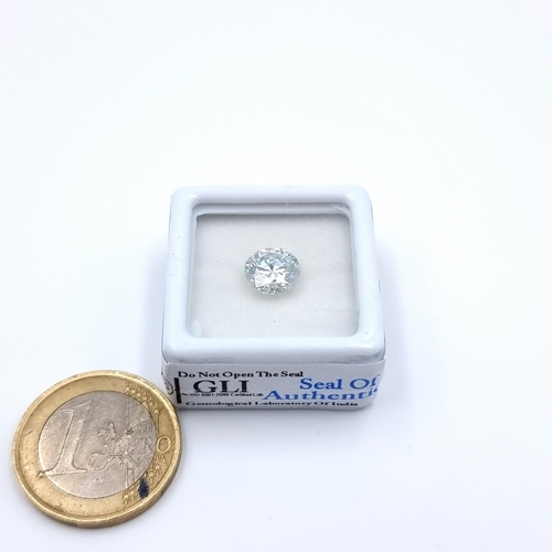 26 - A white brilliant round cut Moissanite stone, of 1.79 carats. Comes with GLI certificate. Fabulous d... 